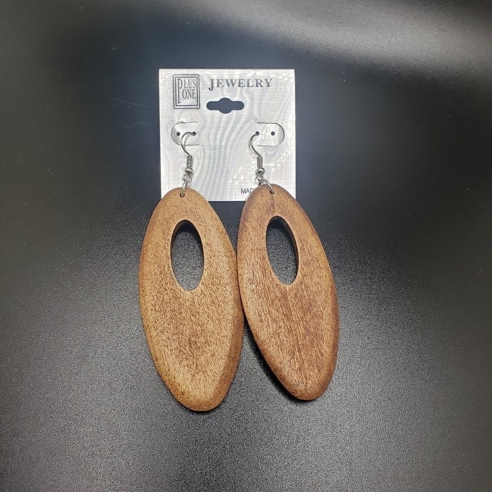 Brown hollowed wood oval long earrings